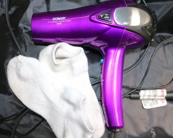 Use a hairdryer in conjunction with thick socks